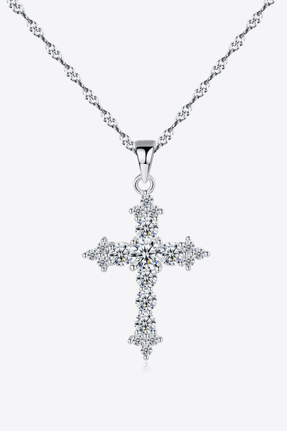 image of the Unique Kulture Zircon Cross Pendant. This elegant pendant features a meticulously crafted 925 Sterling Silver necklace adorned with a stunning Zircon Cross Pendant at its center. The pendant exudes a blend of religious symbolism and contemporary style, making it a versatile accessory for various occasions. The Zircon stones add a touch of sparkle and sophistication to the pendant, catching and reflecting light beautifully. A perfect blend of craftsmanship and elegance, t