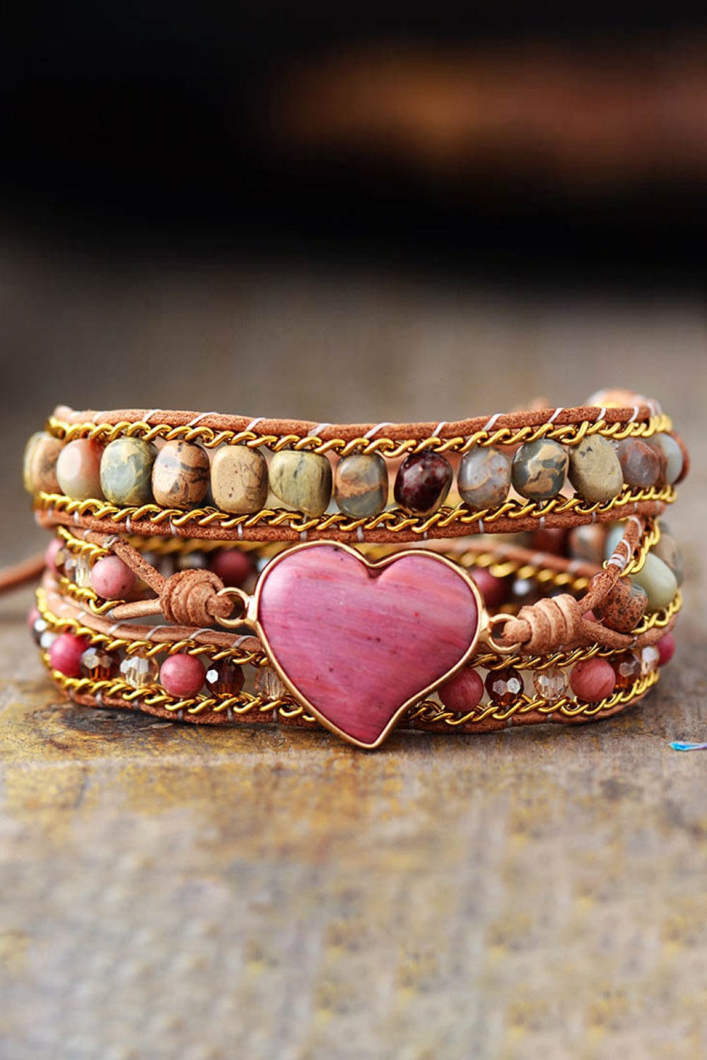 "Capture the essence of artisan craftsmanship with the Unique Kulture Handmade Heart Shape Triple Layer Beaded Bracelet. This exquisite bracelet features three layers of meticulously crafted beads in a heartfelt arrangement, forming a stunning heart shape at its center. The handcrafted design showcases a harmonious blend of colors and textures, adding a touch of elegance to any ensemble. Elevate your style with this one-of-a-kind accessory that celebrates creativity and individuality."