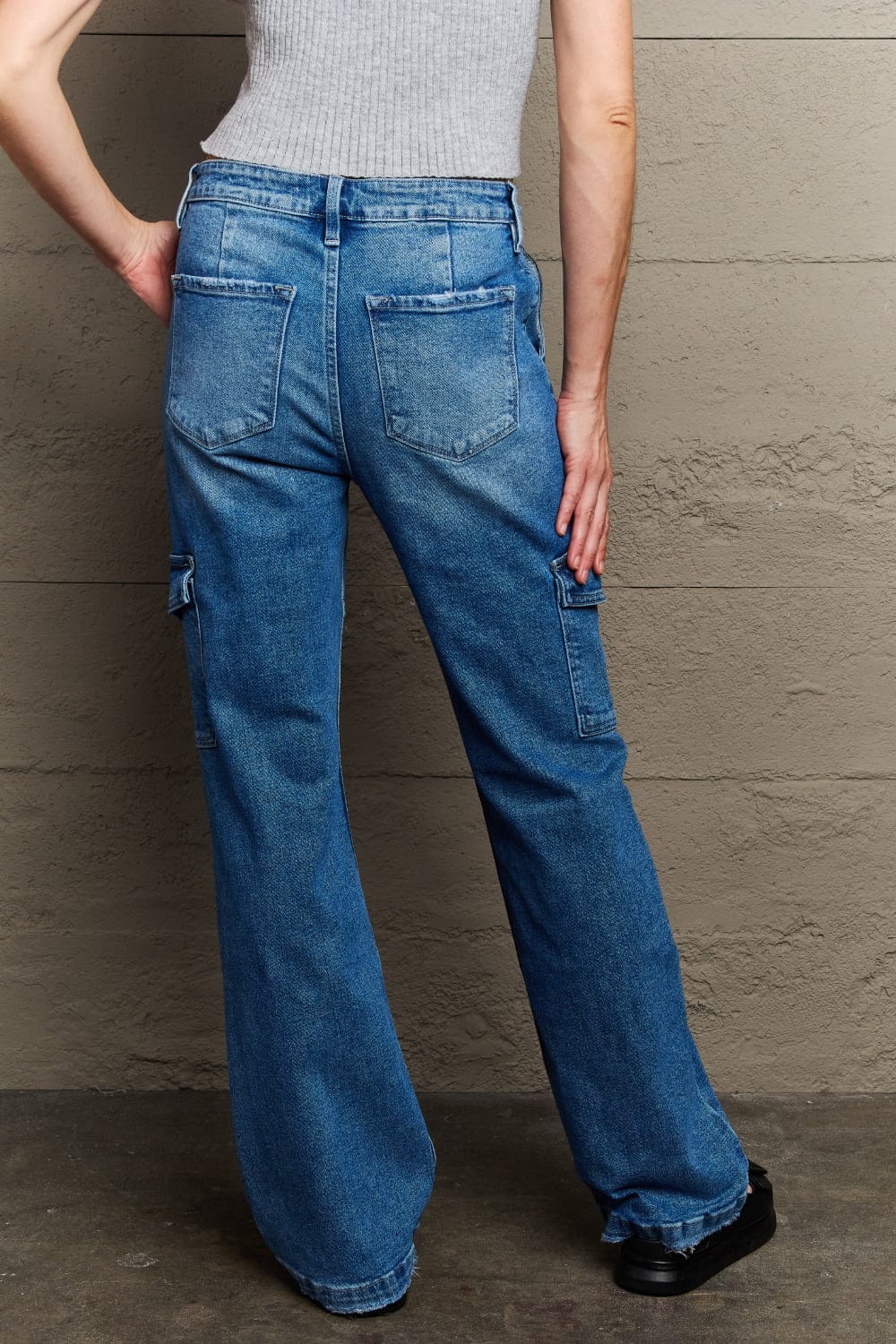 Unique Kulture Kancan Holly High Waisted Cargo Flare Jeans. A stylish pair of high-waisted cargo flare jeans from the Kancan Holly collection. Elevate your fashion with this trendy and versatile denim piece.