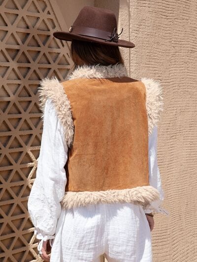 "Alt text: A distinctive Kulture Fuzzy Open Front Vest Coat showcasing a unique design and texture. The vest features an open front, providing a cozy and stylish layering option. The fuzzy texture adds a touch of warmth and fashion-forward flair to the overall look."