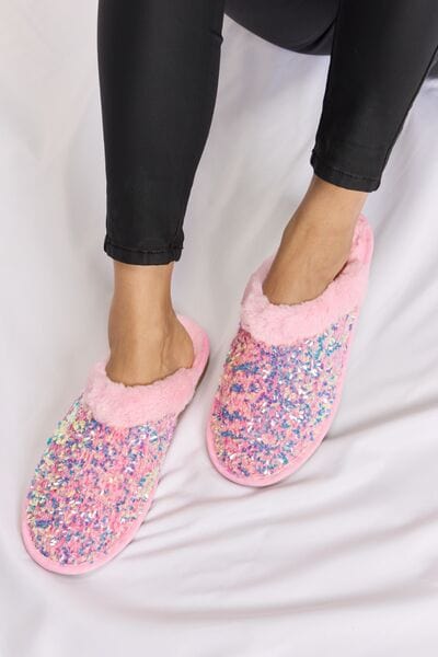 Unique Kulture Forever Link Sequin Plush Round Toe Slippers - Luxurious and stylish slippers adorned with sequins for a touch of glamour. Enjoy ultimate comfort with plush lining and a round toe design. Elevate your relaxation with these fashionable slippers