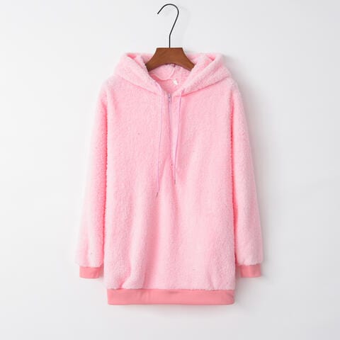 Drawstring Teddy Hoodie. The hoodie features a cozy, teddy bear-like texture and a quarter-zip design with a drawstring hood. The rich, earthy color palette and stylish detailing make it a fashionable and comfortable choice for cooler weather."