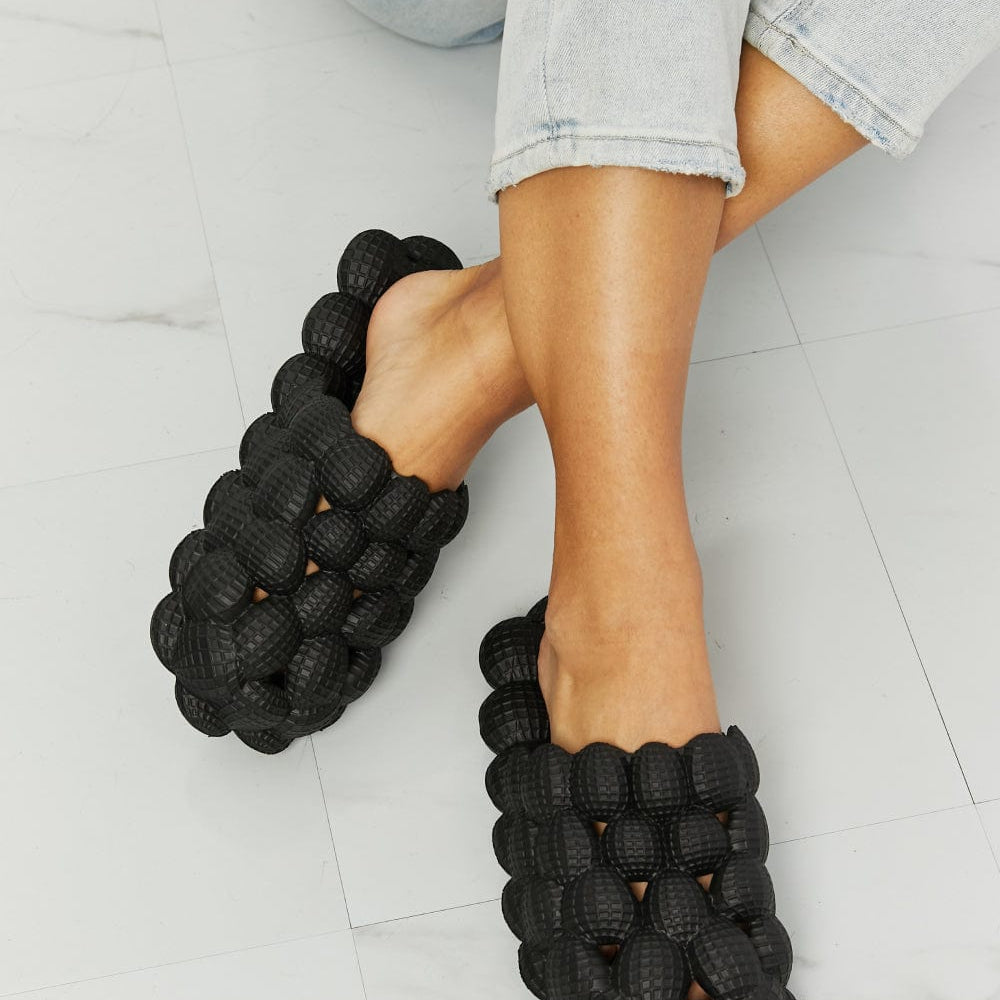 Bubble slides Unique Kulture footwear Designer slides Fashionable sandals Trendy bubble design Stylish slides Comfortable footwear Bubble sole slides Contemporary fashion slides Summer sandals Footwear for casual wear Statement slides Bubble-inspired design Fashion-forward footwear Slide sandals Chic designer slides Unique Kulture collection Bubble-textured slides Elevated slide sandals Versatile fashion slides